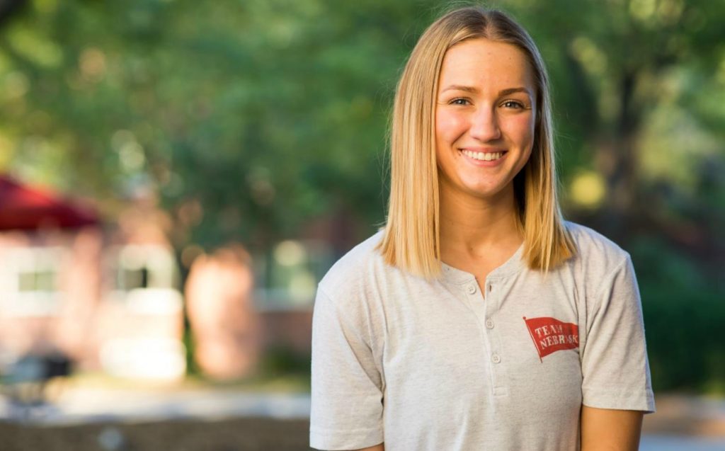 student smiling outdoors